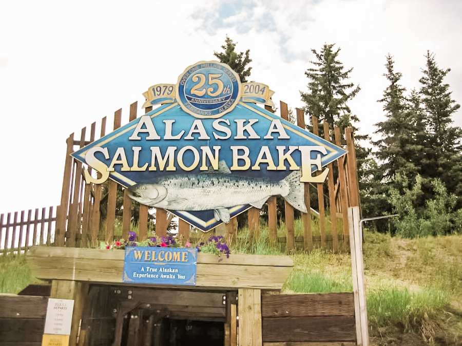 Eating Alaska salmon at a salmon bake in Alaska