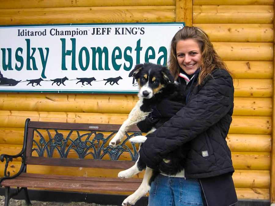 holding dog at Jeff kings husky homestead alaska