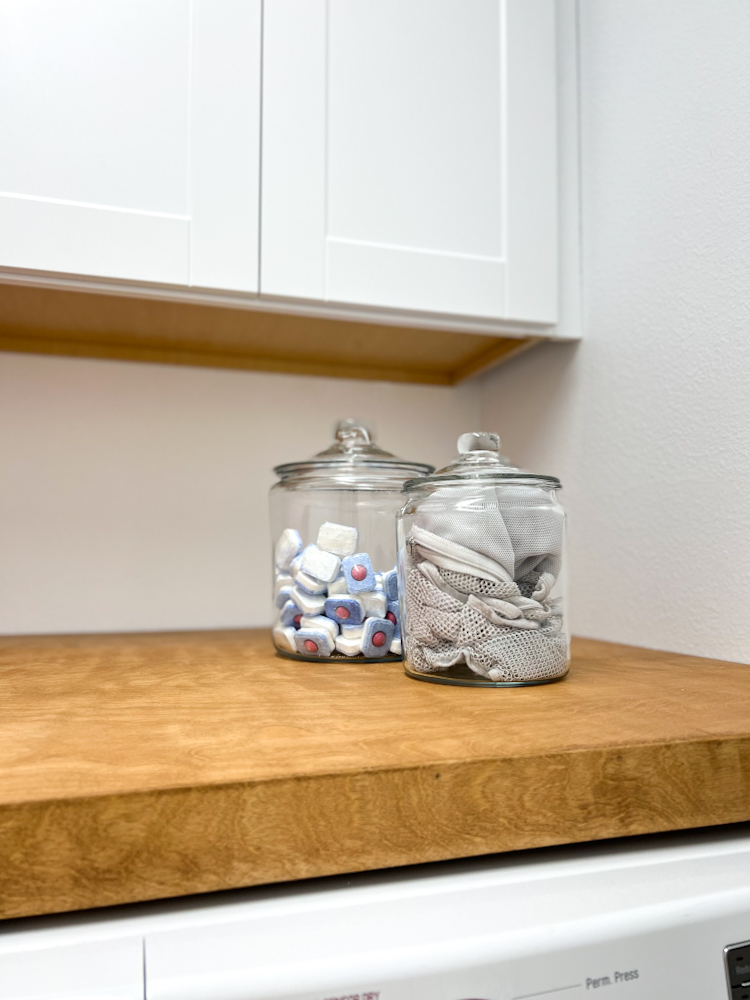 Check out these cute glass jars and other great modern industrial items for our laundry room makeover