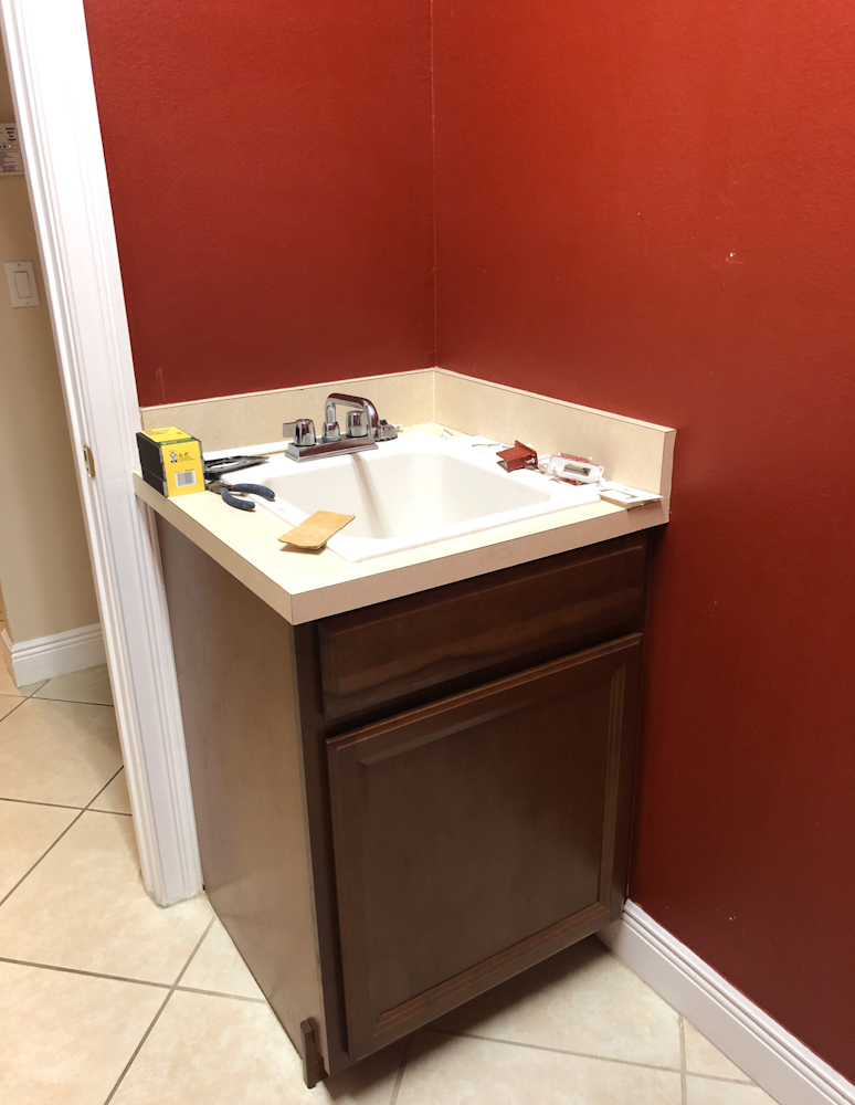 Before photo of our DIY laundry room makeover. Check out the after.