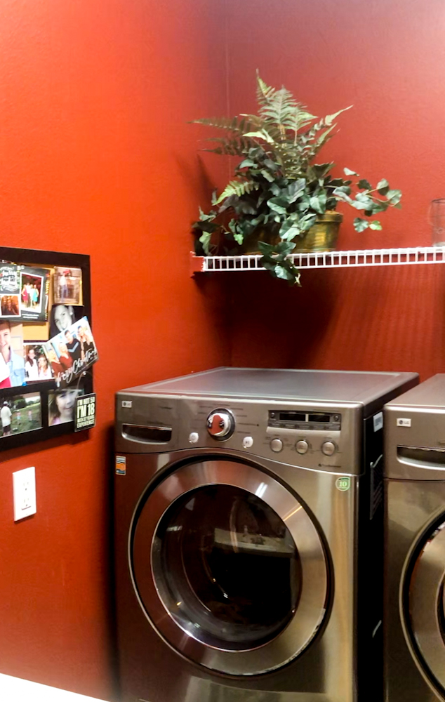 Before photo of our DIY laundry room makeover. Check out the after.