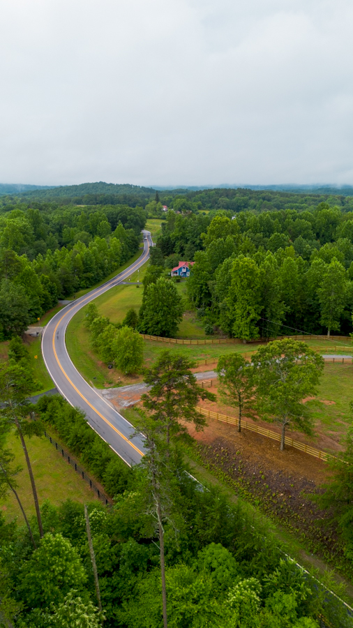 North Georgia in the summer. Drone shot of a country road.