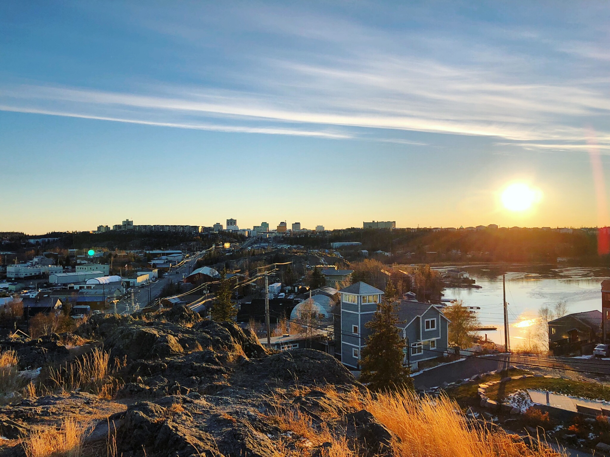 View of the city of Yellowknife, Canada with the sun setting in the background