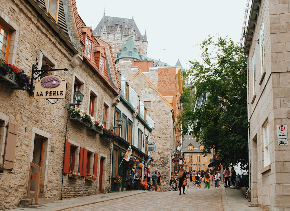 Street view of the old buildings of Old Quebec Canada with some of the larger historic buildings in the background