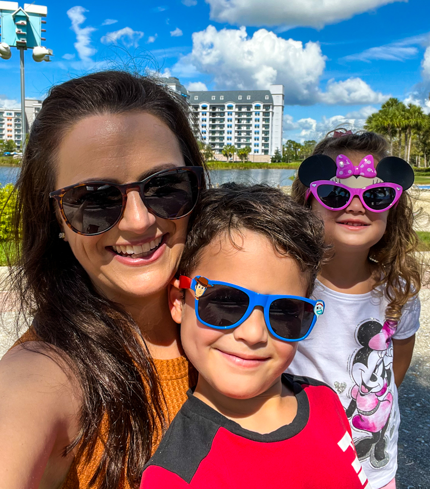 Me and my 2 kids in sunglasses in front of Disney's Riviera Resort