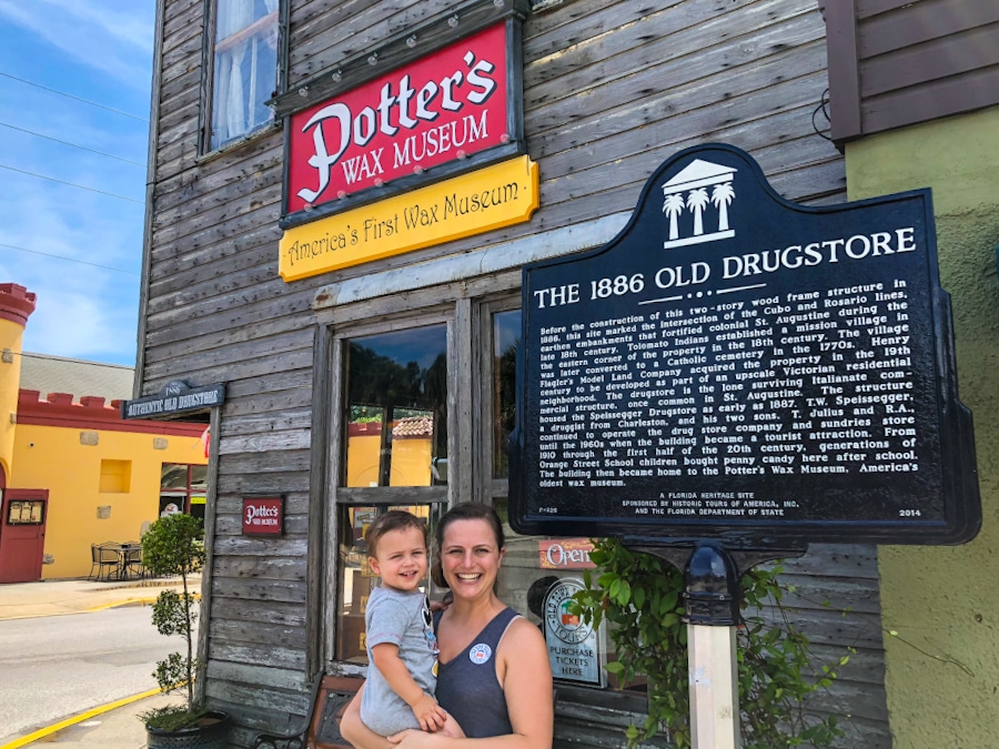 parent and child standing in front of Potter's Wax Museum in St Augustine Florida