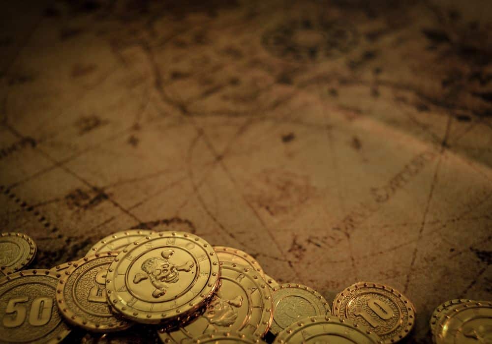 pirate treasure set in the foreground and a pirate map set in the background