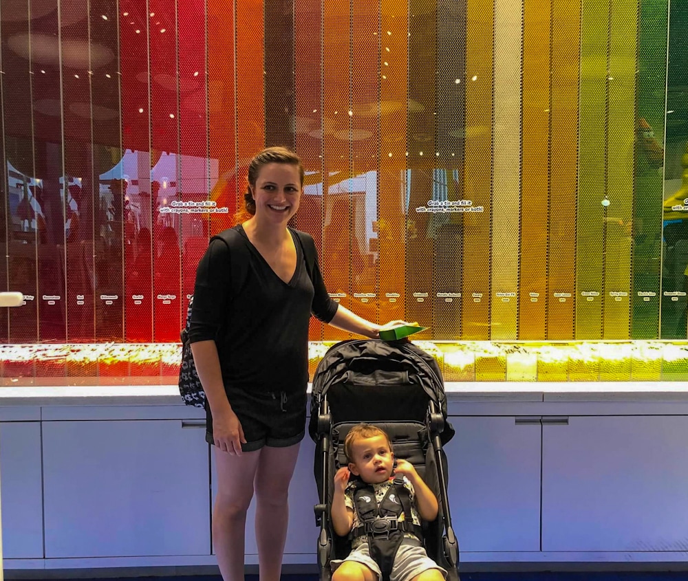 mother and son in front of the pick your pack Crayola crayon wall